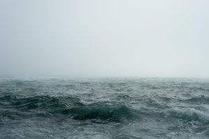 Ocean and cloud covered sky