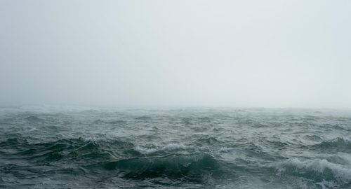 Ocean and cloud covered sky